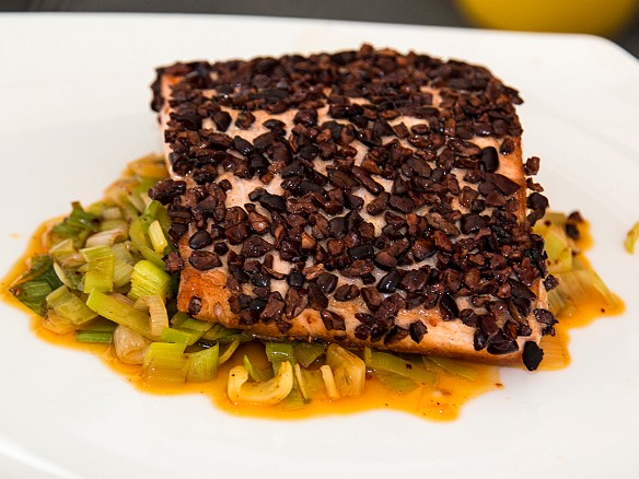 Salmon filet with cacao nibs over a bed of leeks, also sauteed in cocoa butter Jan 18, 2014 3:27 PM : Grand Cayman, Jacques Torres : Maxine Klein,David Zeleznik,Daniel Boulud