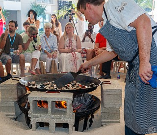 GrandCayman2016-015 Sautéing the chunks of lobster in the giant paella pan over an open wood fire