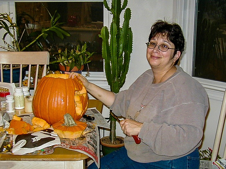 Halloween2003-003 Max has great fun with her new pumpkin carving tools 🎃