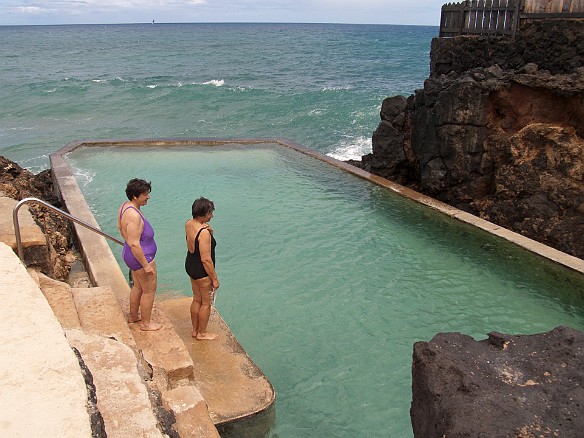The Black Point neighborhood has a private salt water pool that was carved out of the lava shelf and built by the Army during WWII. Mary and Cha entering the pool. May 15, 2010 2:02 PM : Cha Smith, Mary Wilkowski, Oahu