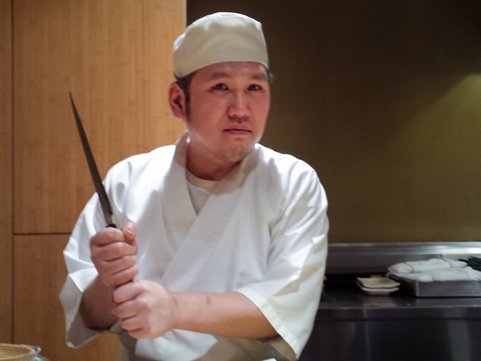 Sushi Yasuda 2014-005 Our sushi chef goes all Jackie Chan on us