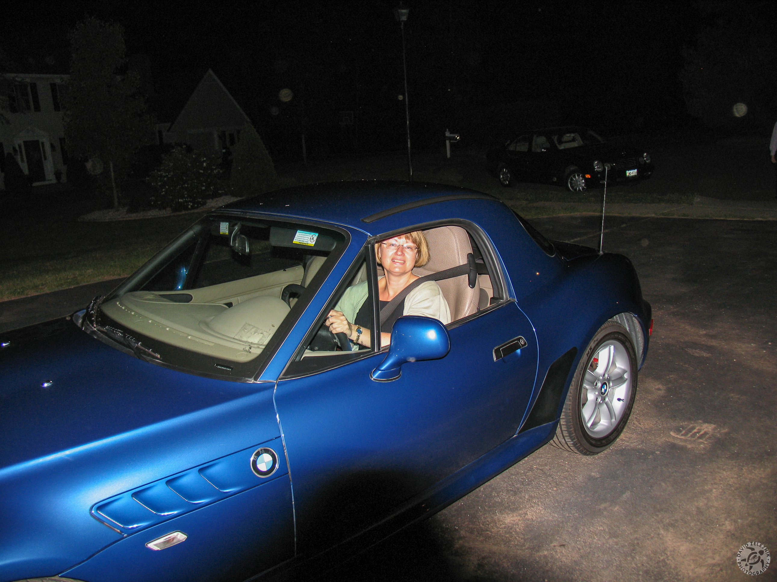 Z3ByeBye-004 While Jim puts the plates on, Karen enjoys her new ride! I put the hardtop on despite the beautiful evening so that they could get it home. as well as learn how to install it.