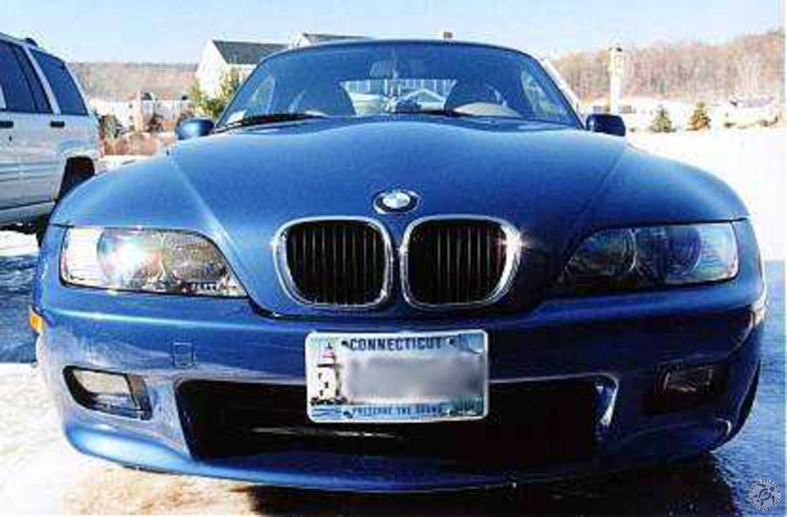 z3_1999winter Here is my Z3 during December 1999, shortly after I took delivery. It's hard to tell from this picture, but the hardtop came installed from the factory. Before driving the car off the lot, I had the dealer install a set of Pirelli Winter 210 Asimmetrico snow tires that I purchased from TireRack mounted on 15" steel rims. Oh, and by the way, that is the same driveway as the next picture. Our driveway faces north and becomes a skating rink during the winter.