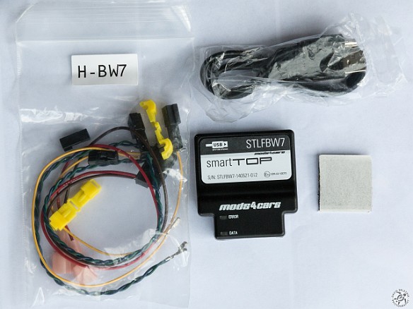 SmartTop Controller-001 Box contents of the smartTop controller for the E85/86 Z4, from L-R: wiring harness and t-tap connectors, the controller module, USB cable, and self-adhesive...