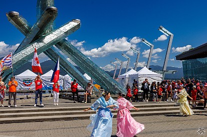 Vancouver-015 In front of the Convention Center and the Olympic Cauldron from the 2010 Winter Games, we sat down to enjoy a performance by a local Filipino folk dance group