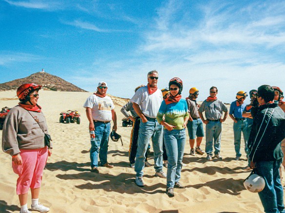 CaboSanLucas-017 Max is geared up and listens to the safety briefing before our ATV ride through the sand dunes