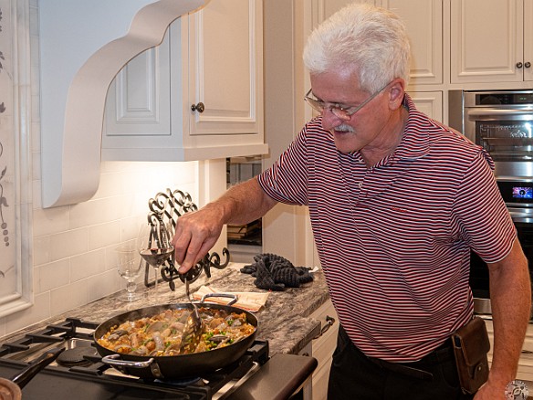 Bluffton2019-024 Sous-chef Jim following Max's instructions to make the paella