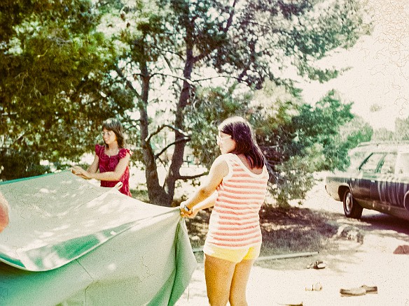 SanClemente1973-001 During Christmas vacation 1973 we flew back to California to visit with friends and go camping at San Clemente State Beach. Deb helping put up one of the tents.
