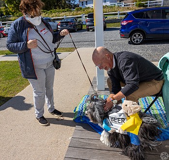 DogsOnTheDock2022-018 The new minister of the First Congregation Church of Essex, the Rev. Dave Stambaugh, blessed the dogs.