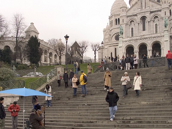 Harpist playing on the steps of the Sacre Coeur Jan 29, 2005 12:55 PM : Paris