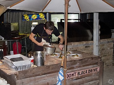 GrandCayman2012-028 Tobi, a young chef from Bavaria, does most of the cooking at the outdoor grill and prep station while Roland flirts with the guests. The food is inventive,...