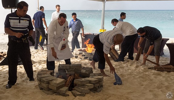 CaymanCookout2013Day1-030 The fire pits that will be used to cook the paella had to be moved 3 times because of the rising tide