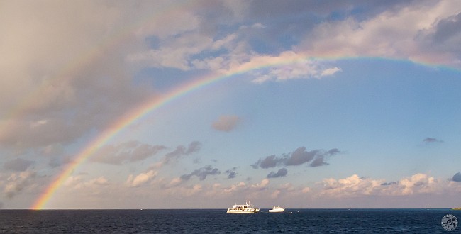 Surface Interval Rainbow In Between dive site, Grand Cayman Surfaced Tuesday morning from our first dive at In Between to find a full rainbow with a slight hint of a double!