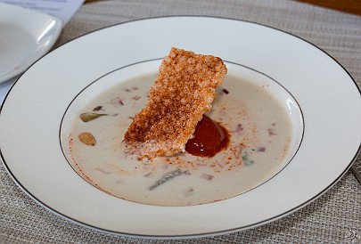 GrandCayman2017-037 First course is a white gazpacho soup with a dollop of red gazpacho sorbet on top. Darn, the 