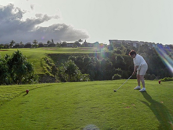 Hawaii2001-007 Max tees off on the 7th 🏌️♀️ The hazard this time is that huge chasm with the green on top of the cliff on the other side. Needless to say, many balls were...