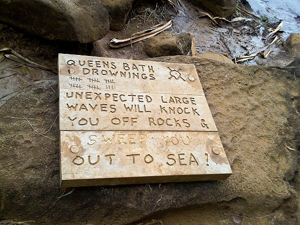 Queen Emma's Bath warning sign. It is a sheltered pool cut into a lava shelf. When it is nice, it is nice, but if the surf is up, watch out! May 2, 2010 11:11 AM