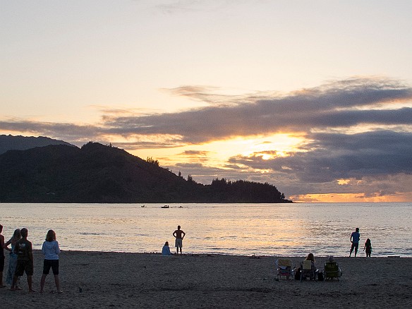 People gather on the Hanalei Beach as the sun goes down. Some color, but too cloudy for a good sunset. Amazing nonetheless as people wordlessly stream onto the beach as the appointed hour grows near. May 14, 2012 7:01 PM : sunset