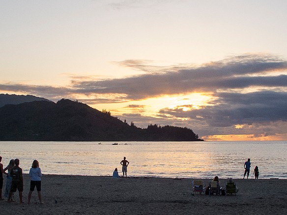 People gather on the Hanalei Beach as the sun goes down. Some color, but too cloudy for a good sunset. Amazing nonetheless as people wordlessly stream onto the beach as the appointed hour grows near. May 14, 2012 7:01 PM : Kauai