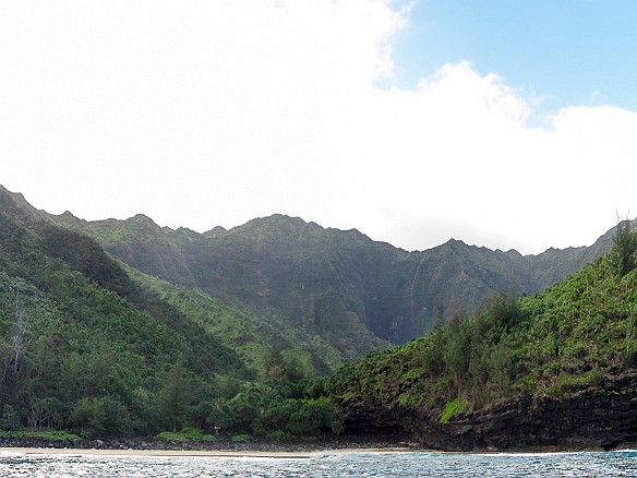 Hanakapi'ai beach and valley is a two mile day hike in along the Kalalau Trail. This is as far as you can hike without permits and without being fully outfitted for backpacking. May 14, 2013 8:15 AM
