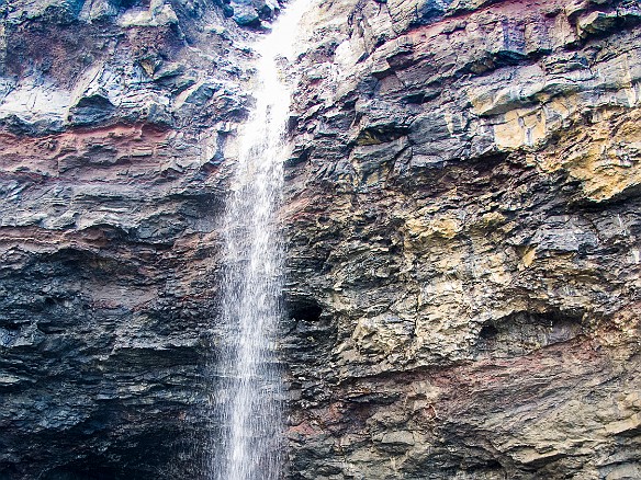A waterfall drops right in front of the entrance to a sea cave May 14, 2013 8:23 AM