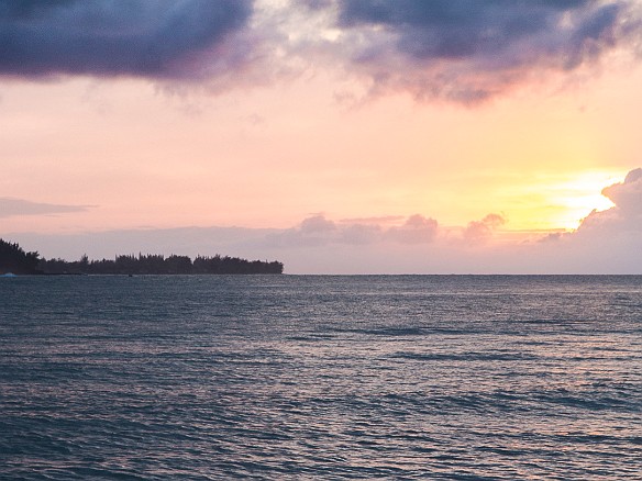 Kids playing in the surf as the sun goes down over Hanalei Bay May 15, 2014 7:04 PM : Kauai