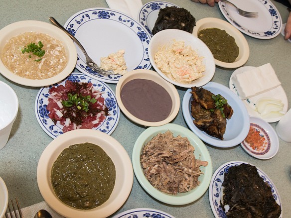 Top row, left to right: lau lau, squid luau. Second row: chicken long rice, mac salad, haupia. Third row: ahi poke, poi, fried butterfish collar, alaea sea salt. Fourth row: squid luau, kalua pig, lau lau. May 9, 2014 1:49 PM : Oahu