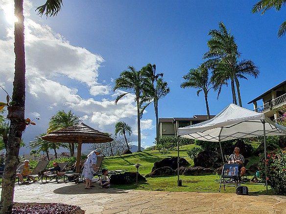 Kauai-028 Mike Keale entertaining poolside. Unfortunately not much of a crowd since this brief spot of blue sky was just that- very brief followed by a cold downpour. You...