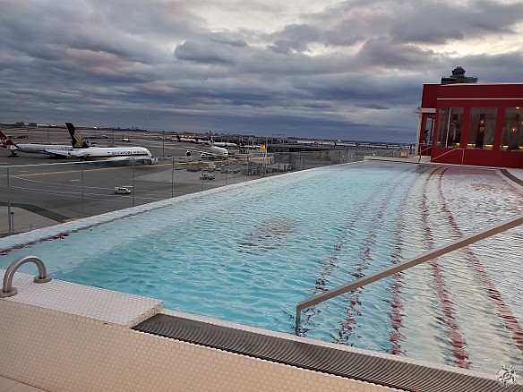 Oahu-009 Heated infinity pool and bar on the roof deck overlooking the tarmac