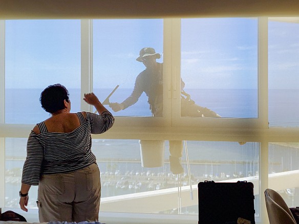 Oahu-022 Scared the living bejeezus out of us when this guy rappelled down from above and suddenly appeared right in front of us squeegeeing our 31st floor window!