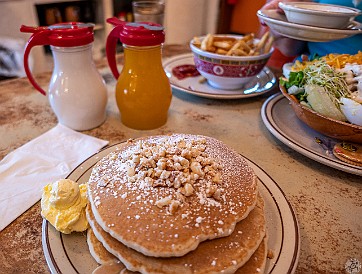 HiloVolcano-010 After 3+ weeks in Hawaii, my deprivation was alleviated by Ken's awesome stack of mac-niut pancakes with a choice of coconuy and lilikoi (passionfruit) syrups....