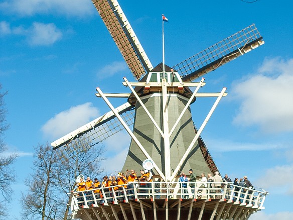 Keukenhof-027 There are a couple of windmills that provide scenic vantage points for visitors. A local marching band was using this one as its stage.