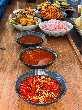 Maxine70thBirthday-027 Colt had been fermenting for days and the banchan started being put out on the counter: kimchi cabbage, kimchi daikon, kimchi cukes, pickled onions, and several...