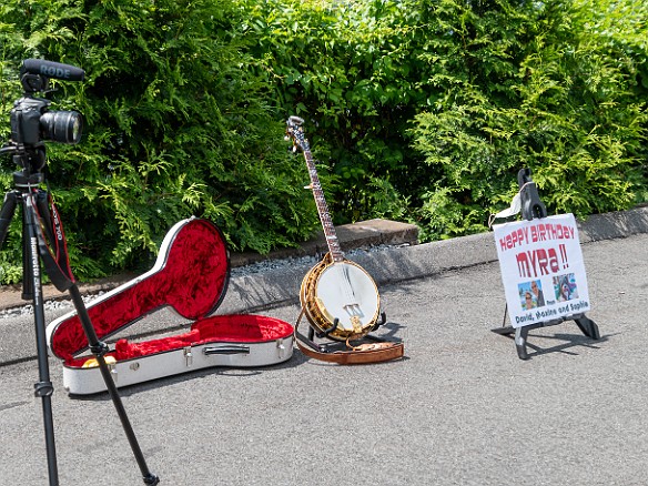 Myra84thBirthday-004 I setup my camera, banjo to play Happy Birthday, and a poster I made in the driveway outside her window