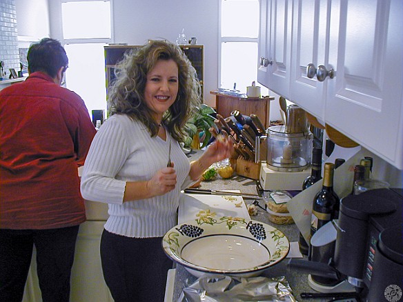 NewYear2001-003 Couples were paired up to cook one course of the 4-course dinner. We joined Lance and Tracey Richards from across the street to cook the main course..