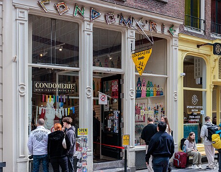 Amsterdam2025-014 As luck would have it, we *had to* walk through part of the Red Light District to get to our hotel, past the quite colorful and entertaining Condomerie boutique...