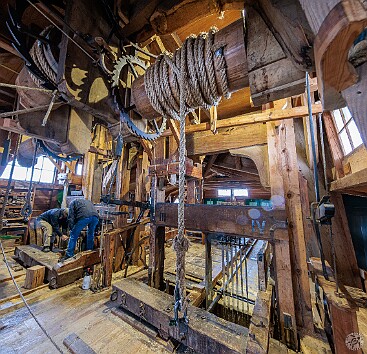 Amsterdam2025-035 Fascinating to watch the mechanism inside the Het Joge Schaap sawmill. An overhead camshaft is driven by the sails, which then drives the vertical saw blades up...