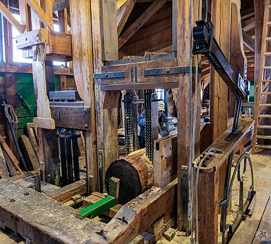 Amsterdam2025-036 Fascinating to watch the mechanism inside the Het Joge Schaap sawmill. An overhead camshaft is driven by the sails, which then drives the vertical saw blades up...