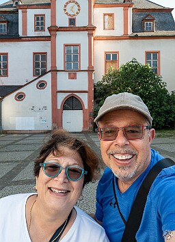 Koblenz2025-027 The happy scavengers made it to the first clue- St. Florin's Market Square and the tower clock on the old dance and shopping hall behind us