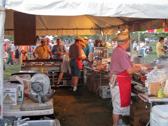 Timmy up front with the customers, Tommy with the last of the catfish on the griddle Sep 5, 2010 8:00 PM : Chili Brothers, Rhythm and Roots 2010