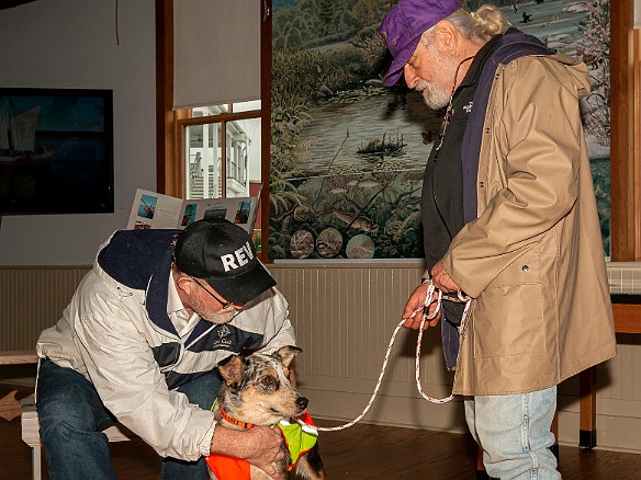 DogsOnTheDock2021-015 Rev. Ken Peterkin of the Essex First Congregational Church gave each dog a blessing in the museum boathouse.