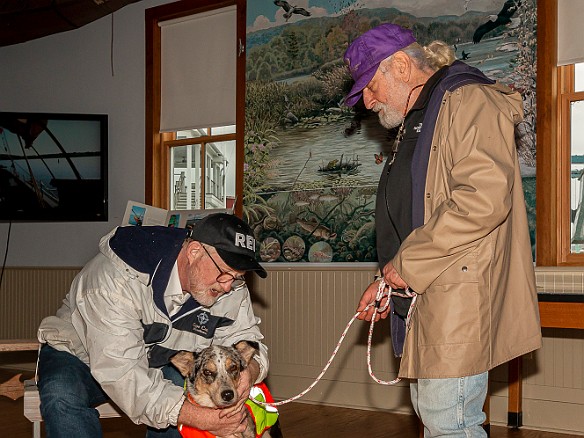 DogsOnTheDock2021-016 Rev. Ken Peterkin of the Essex First Congregational Church gave each dog a blessing in the museum boathouse.