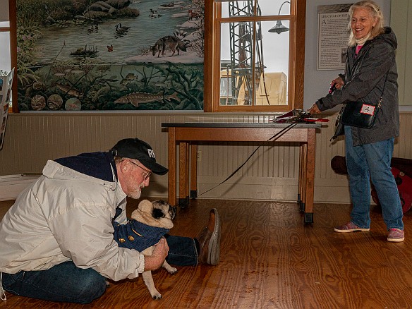 DogsOnTheDock2021-024 Rev. Ken Peterkin of the Essex First Congregational Church gave each dog a blessing in the museum boathouse.