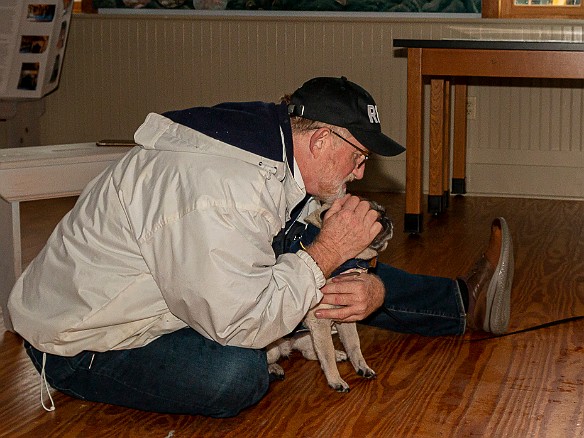 DogsOnTheDock2021-025 Rev. Ken Peterkin of the Essex First Congregational Church gave each dog a blessing in the museum boathouse.