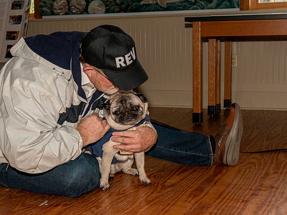 DogsOnTheDock2021-026 Rev. Ken Peterkin of the Essex First Congregational Church gave each dog a blessing in the museum boathouse.