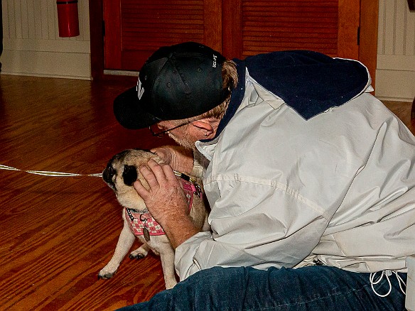 DogsOnTheDock2021-028 Rev. Ken Peterkin of the Essex First Congregational Church gave each dog a blessing in the museum boathouse.