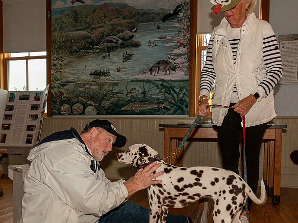 DogsOnTheDock2021-031 Rev. Ken Peterkin of the Essex First Congregational Church gave each dog a blessing in the museum boathouse.