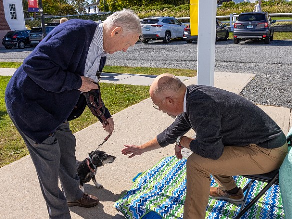 DogsOnTheDock2022-012 The new minister of the First Congregation Church of Essex, the Rev. Dave Stambaugh, blessed the dogs.