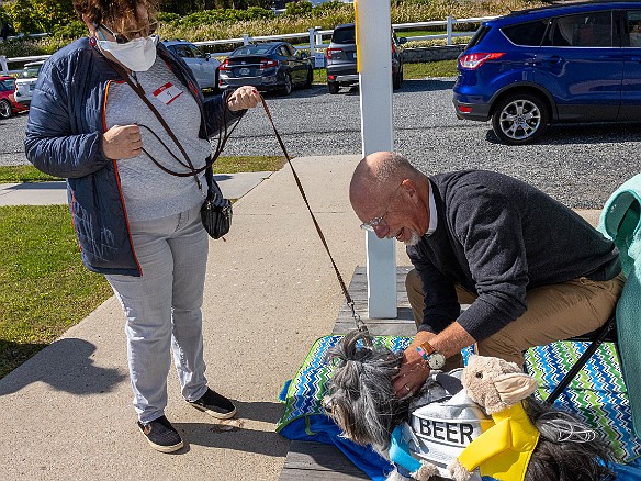 DogsOnTheDock2022-018 The new minister of the First Congregation Church of Essex, the Rev. Dave Stambaugh, blessed the dogs.