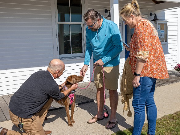 DogsOnTheDock2022-024 The new minister of the First Congregation Church of Essex, the Rev. Dave Stambaugh, blessed the dogs.