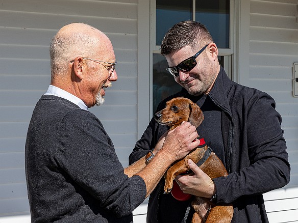 DogsOnTheDock2022-025 The new minister of the First Congregation Church of Essex, the Rev. Dave Stambaugh, blessed the dogs.